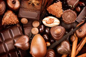 Chocolates background. Praline chocolate sweets